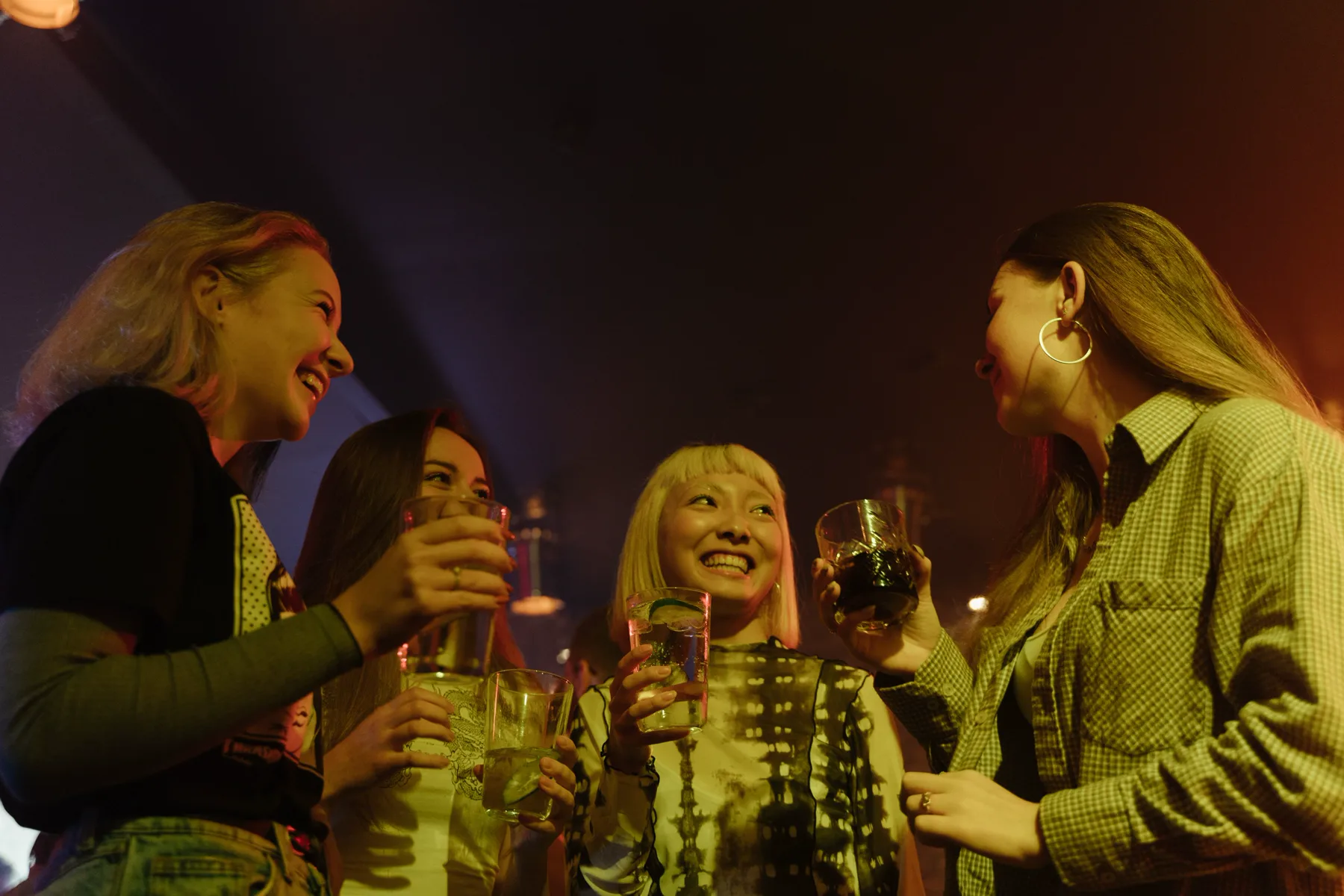 Friends sharing drinks during a night out